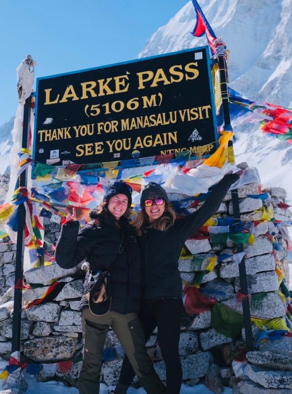 Two trekkers celebrating at Larke Pass (5106m), Manaslu Circuit Trek.