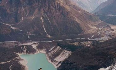 Snow-capped Mount Manaslu peak glowing at sunrise in the Himalayas, Nepal.