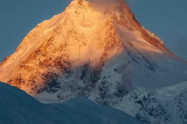 Golden sunrise on Mount Manaslu peak during the Manaslu Circuit Trek in Nepal.