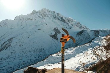 Manaslu Circuit Trek trail with snow covered Himalayan mountains near Larkya La Pass, Nepal
