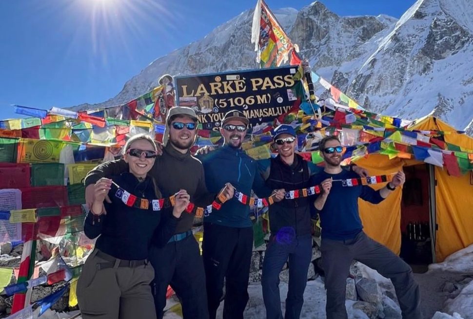 Group of trekkers from Germany and the UK at Larkya La Pass on the Manaslu Circuit Trek