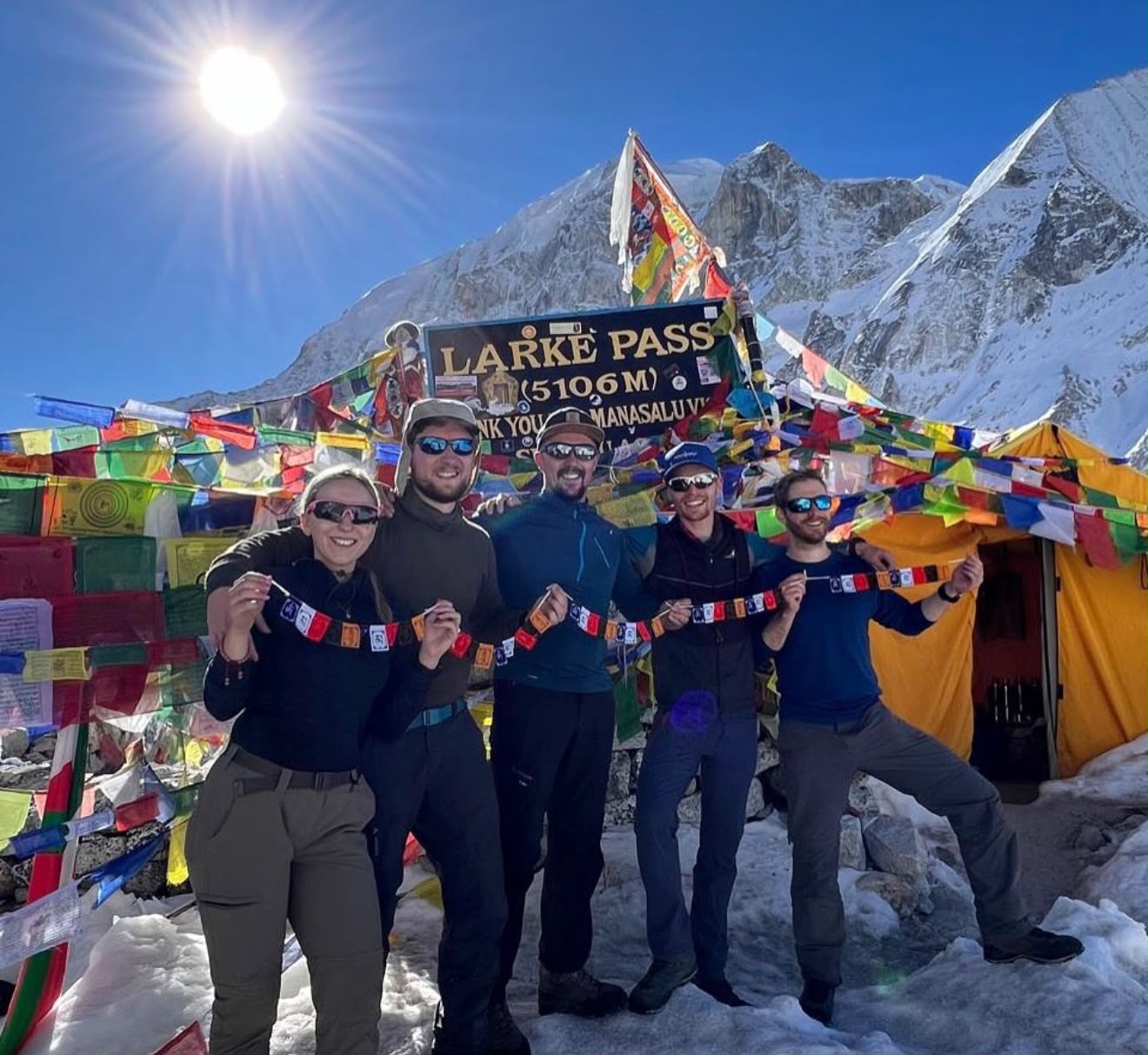 Group of trekkers from Germany and the UK at Larkya La Pass on the Manaslu Circuit Trek