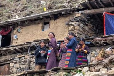 Local people using mobile internet in a village along the Manaslu Circuit Trek