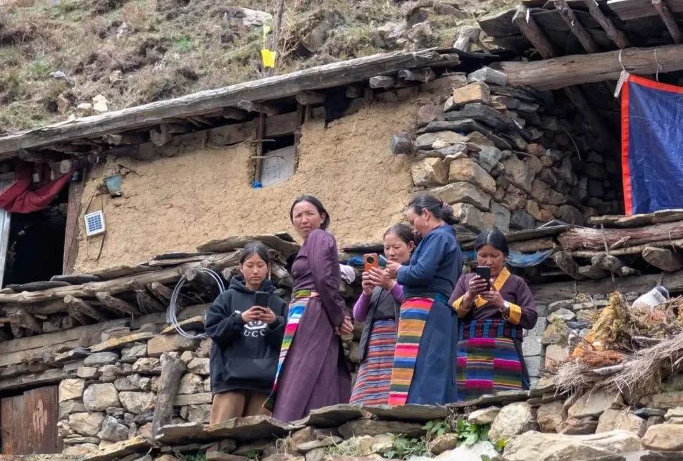 Local people using mobile internet in a village along the Manaslu Circuit Trek