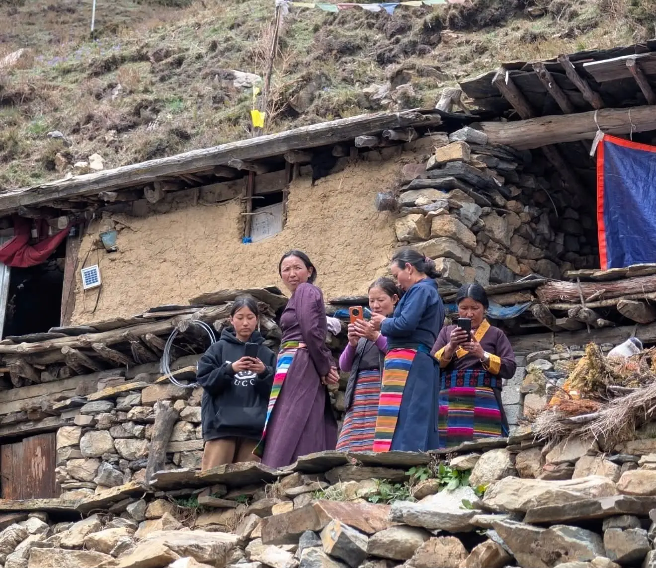 Local people using mobile internet in a village along the Manaslu Circuit Trek